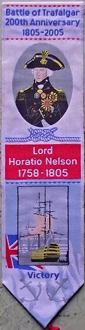 J & J Cash woven bookmark, with title words and portrait of Nelson