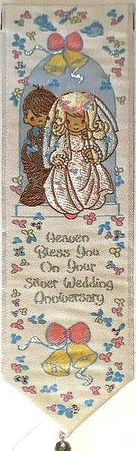 Cash's woven bookmark, with title words and image of a bride and groom