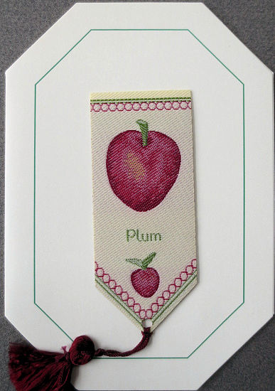 Cash's greeting card, with an attached woven bookmark titled: PLUM