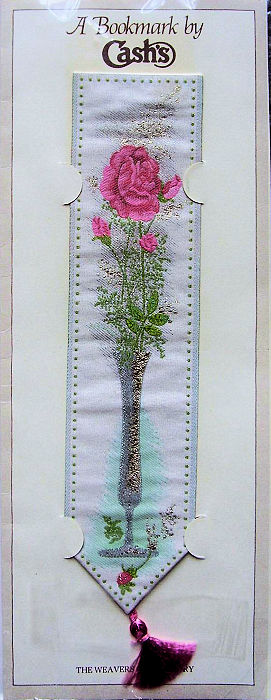 J & J Cash woven bookmark, with no words, but images of a rose in a vase