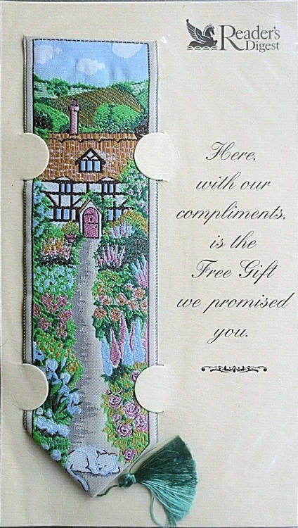 J & J Cash woven bookmark, with no words and image of a Cottage garden with cat, as issued by Readers Digest