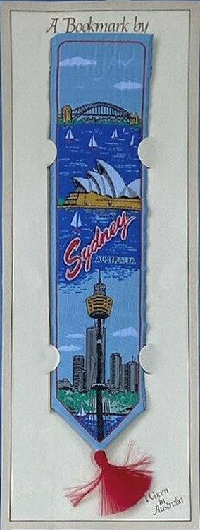 J & J Cash woven bookmark, with title words and views of Sydney