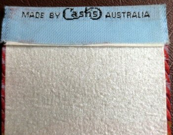 CASH'S name woven on reverse top turn-over of this bookmark