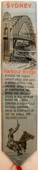 J & J Cash woven bookmark, with title words and view of Sydney Harbour Bridge