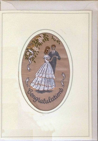 J & J Cash's greetings card with words woven on tapestry, CONGRATULATIONS, and image of a wedding couple