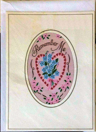 J & J Cash's greetings card with words woven on tapestry, REMEMBER ME, and image of a floral heart