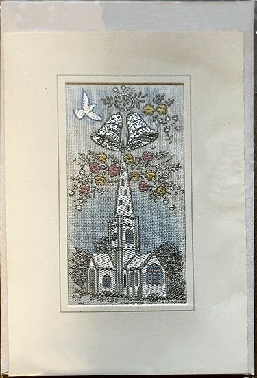 J & J Cash's greetings card with no words woven on tapestry, just picture of a church with dove and wedding bells