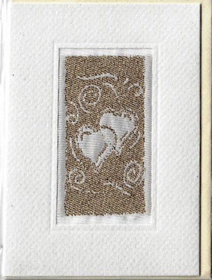J & J Cash woven card, with image of two hearts