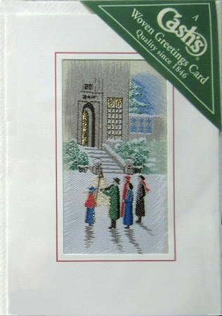 J & J Cash woven Christmas card, with no words, but image of Carol singers outside an open door