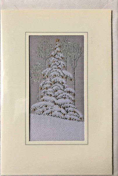 J & J Cash woven Christmas card, with no words, with image of a Christmas Tree covered in snow