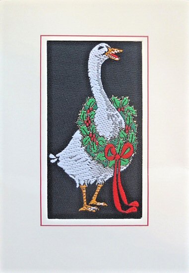 J & J Cash woven Christmas card, with no words, but image of a goose with wreath round its neck