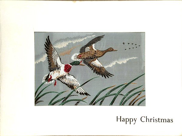 Christmas card with image of Mallard ducks in flight
