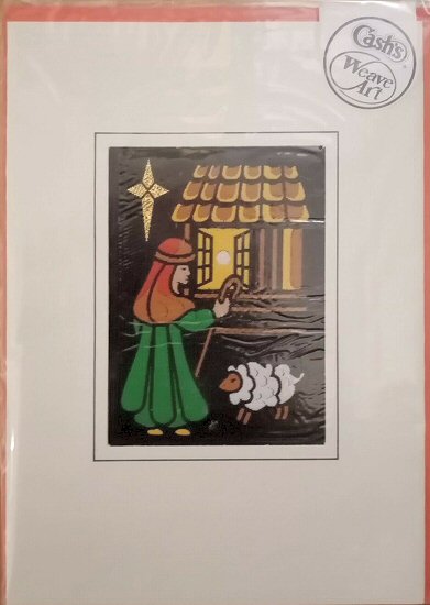 J & J Cash woven Christmas card, with no words, with image of a Shepherd nearing a stable and star