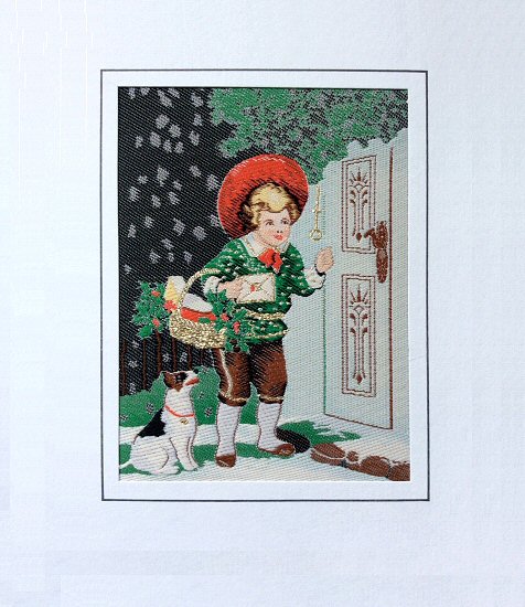 J & J Cash woven Christmas card, with no words, but image of a child at front door with a basket and a dog