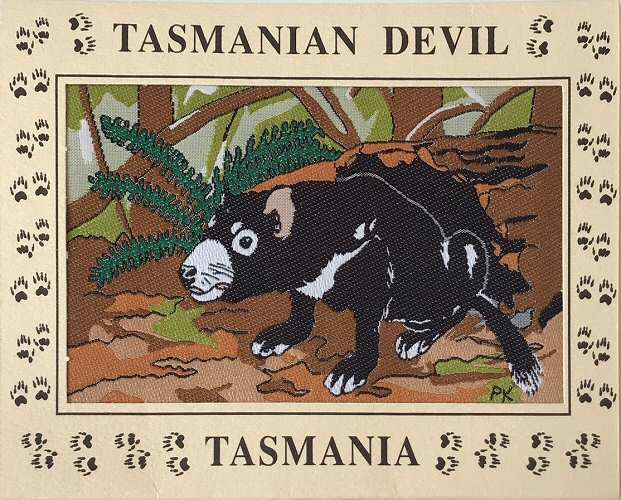J & J Cash woven card, with title words, and image of the Tasmanian Devil animal