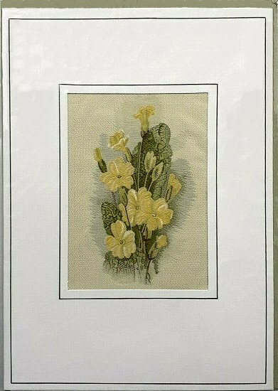 J & J Cash woven flower card, with image of primroses