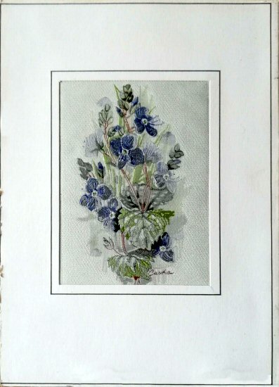 J & J Cash woven flower card, with no title words, just image of a speedwell