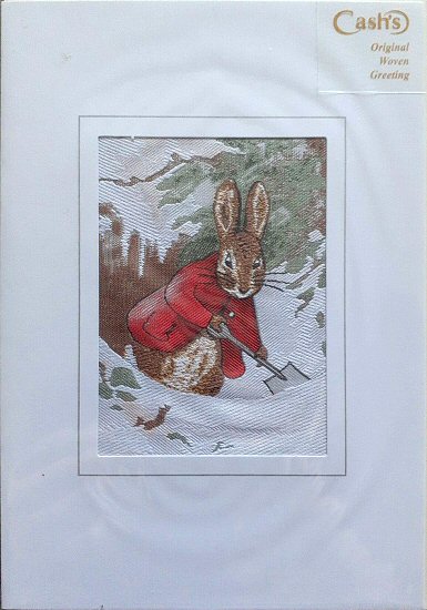 J & J Cash woven card, with no title words, but image of a Rabbit digging in the snow