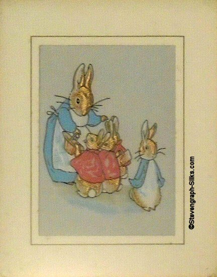 J & J Cash woven card, with no title words, but image of Peter Rabbit & family