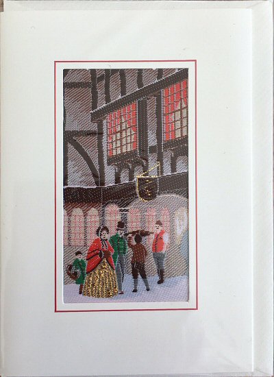 J & J Cash woven card, with no words, with image of a street scene reminiscent of Dickens time