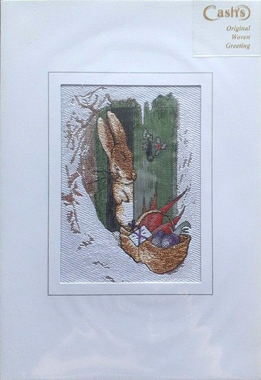 J & J Cash woven card, with no title words, but image of a Rabbit finding a basket of food outside the front door