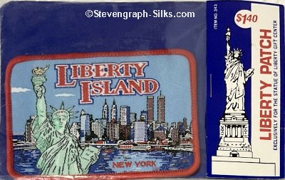 J & J Cash woven saw-on label with words: Liberty Island, New York