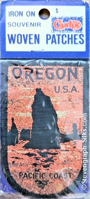 J & J Cash woven saw-on label with words: Oregon U.S.A. Pacific Coast