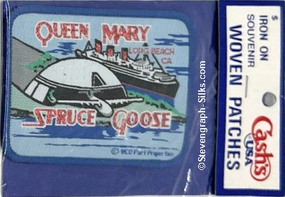 J & J Cash woven saw-on label with words: Queen Mary - and Spruce Goose