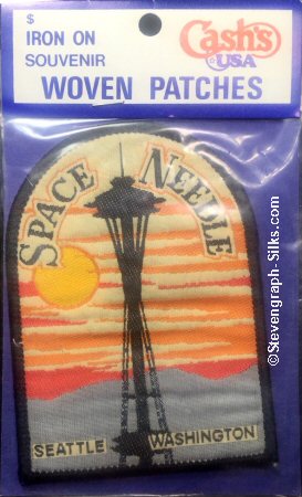 J & J Cash woven saw-on label with words: Space Needle, Seattle, Washington
