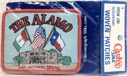 J & J Cash woven saw-on label with words: The Alamo San Antonio Texas