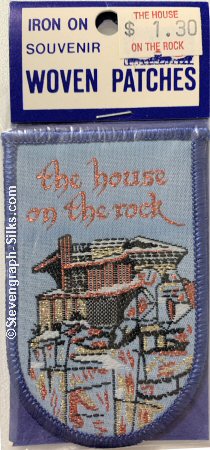 J & J Cash woven saw-on label with words: The House on the rock