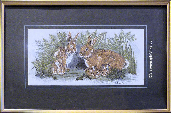 J & J Cash woven picture with image of a family of rabbits
