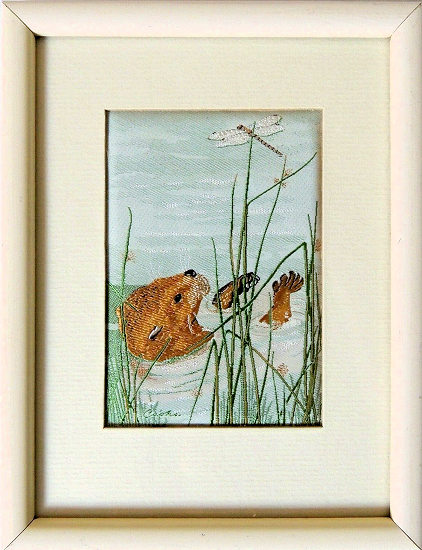 J & J Cash woven picture with image of an Otter with a dragonfly