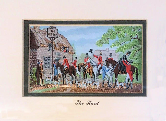 J & J Cash woven picture with image of horses and riders meeting outside of the village pub