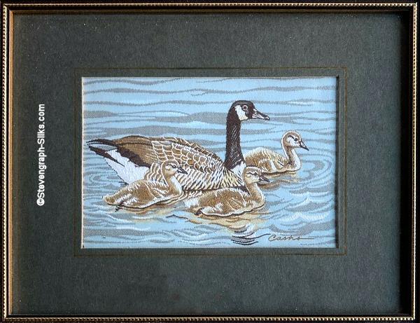 J & J Cash woven picture of a bird, with no words, but image of a Canada Goose with three young