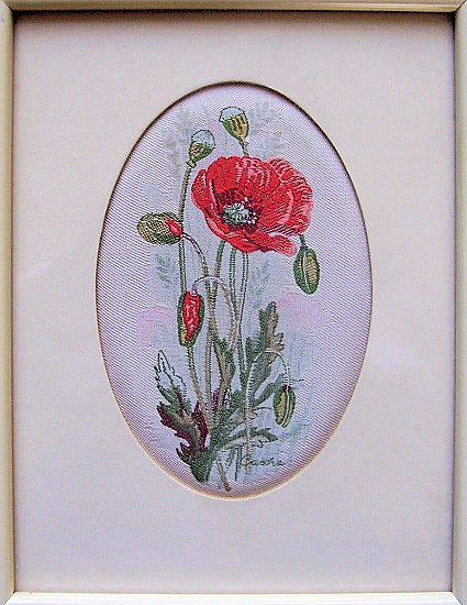 J & J Cash woven picture of a red poppy with several buds