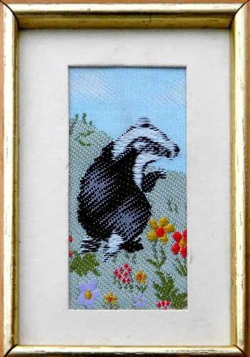 J & J Cash woven picture with image of a Badger