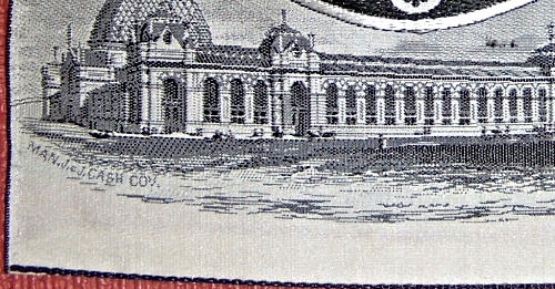 close up of the woven CASH'S name on the front lower left corner of the silk