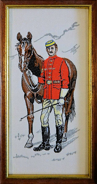 J & J Cash woven picture with image of a North West Mounted Policeman dressed in 1873 uniform