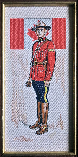 J & J Cash woven picture with image of a Royal Canadian Mountie