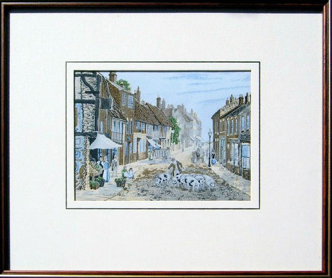 J & J Cash woven scenic picture of an old world street with pigs being herded