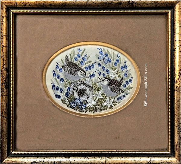 Framed woven picture of a pair of wren birds, with nest and eggs