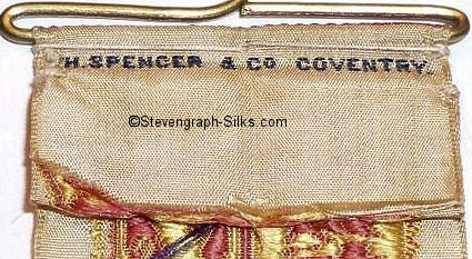 Woven credit on the reverse of this badge
