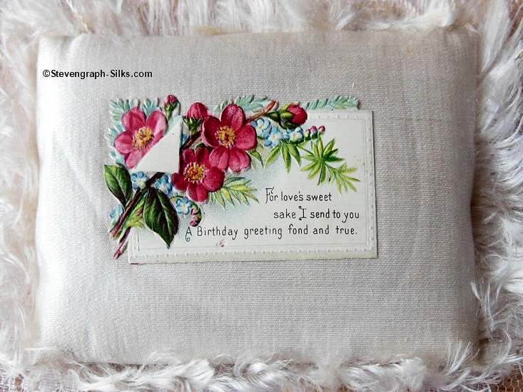 first card attached to woven silk cushion