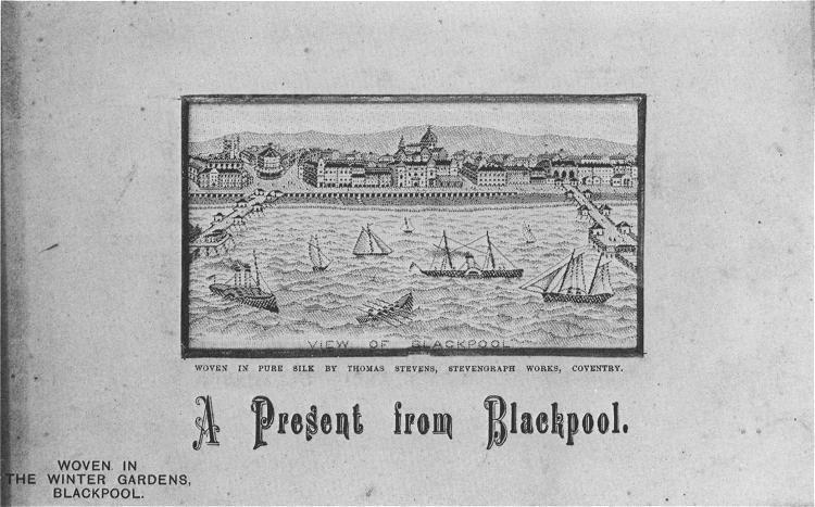 Image of Blackpool, bounded by two piers, with various craft in the sea.