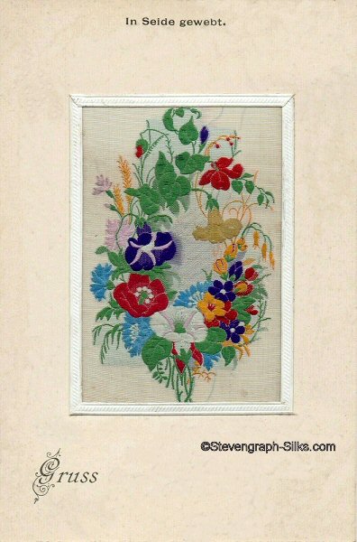 postcard with part of a Stevens woven silk bookmark, showing various flowers and buds