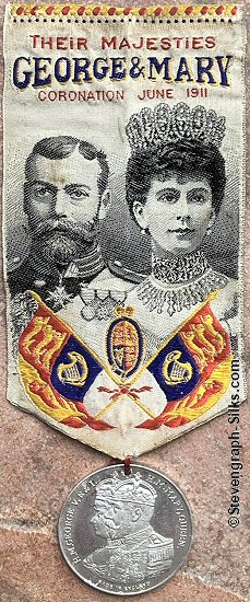ribbon with words and portrait images of King George V and Queen Mary, with medal attached to pointed end