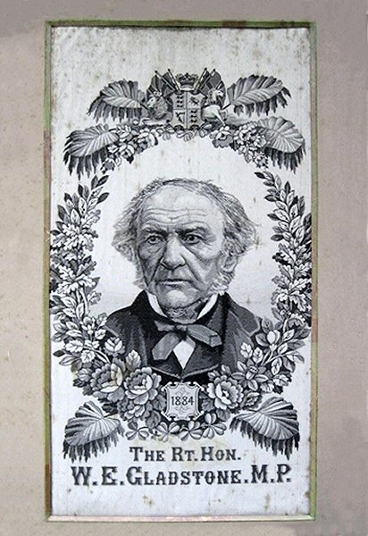 black and white portrait of W.E. Gladstone, with woven date of 1884