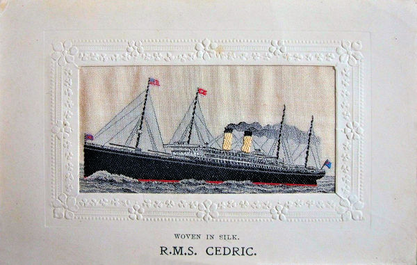 woven image of ship, with small flags on front two masts only, and ships name printed below silk