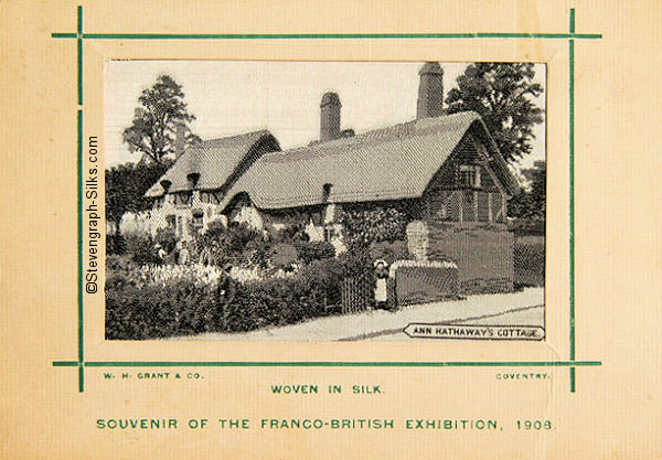 black and white silk picture of thatched cottage, mounted on card with green border